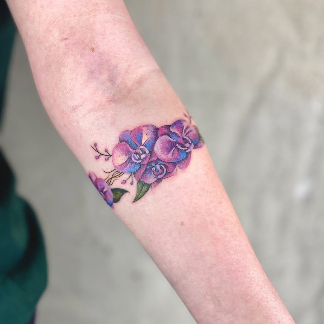 Stunning vibrant purple orchid tattoo design