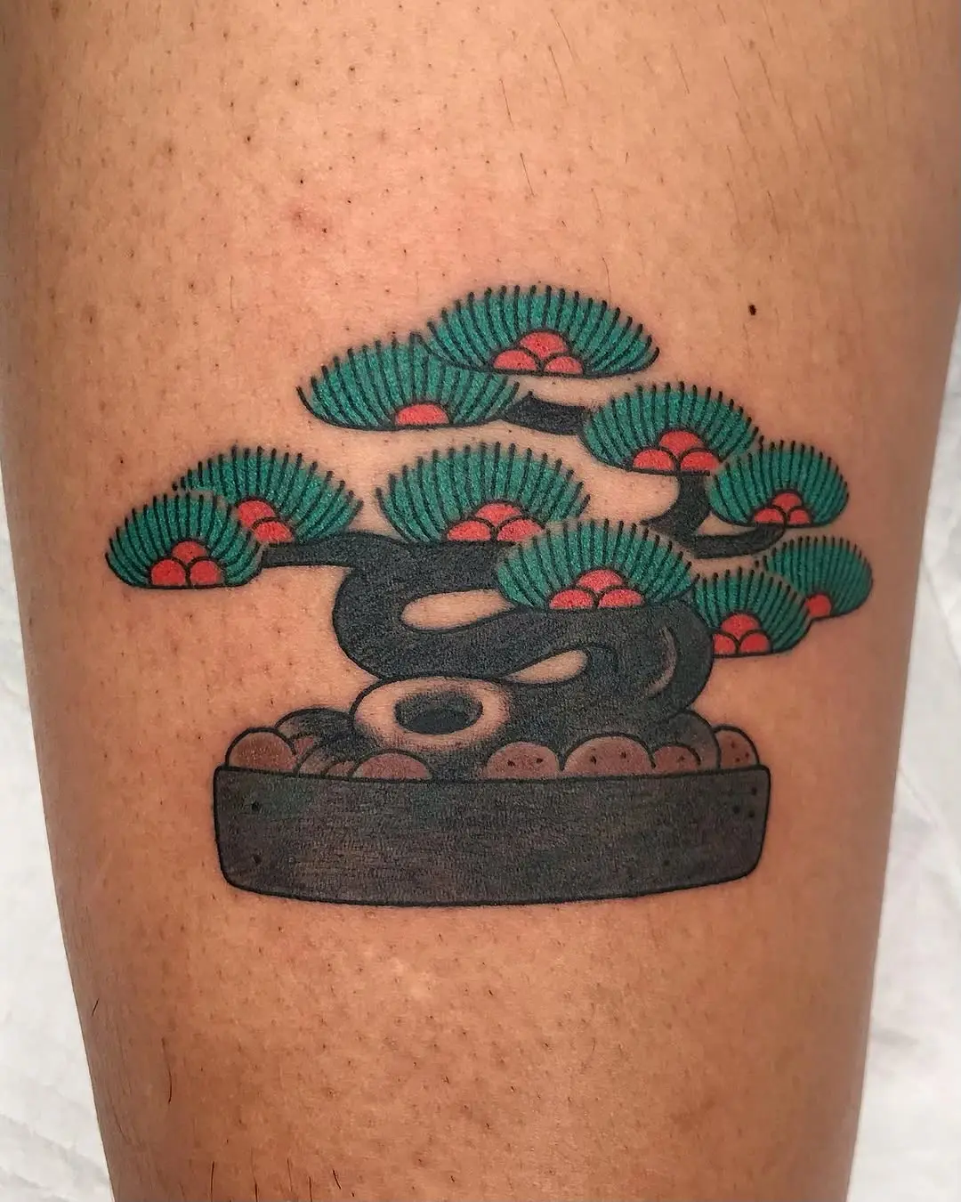 Colorful bonsai tattoo with intricate detailing