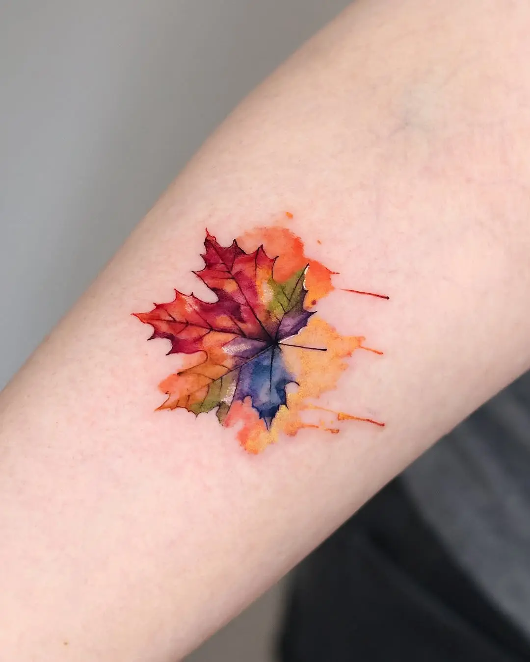 Stunning watercolor maple leaf tattoo design