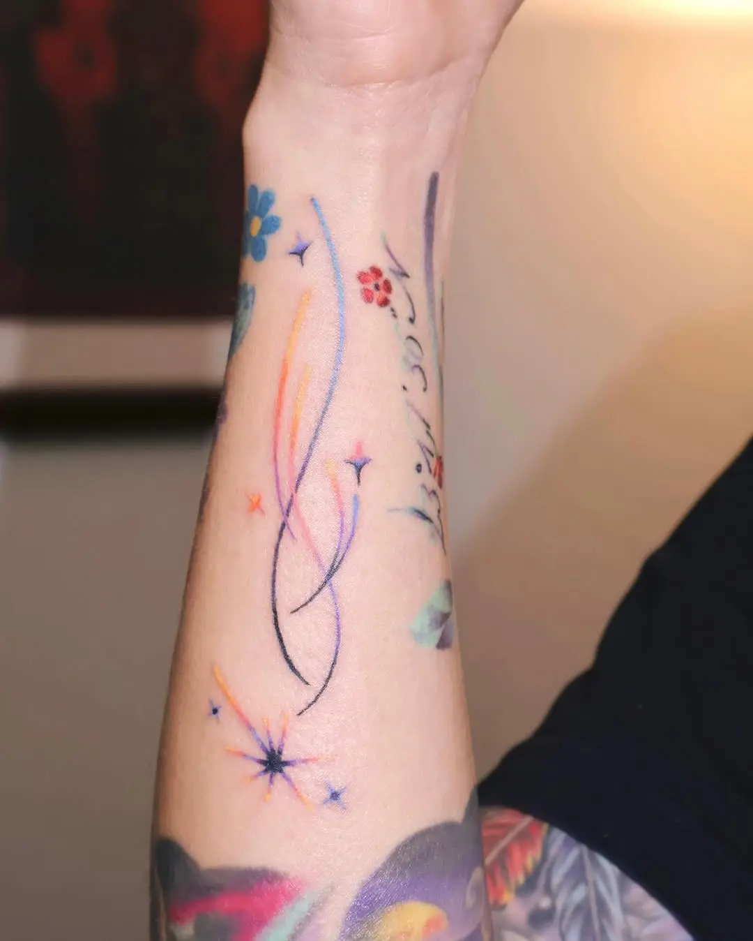 Whimsical Meteor Tattoo with Colorful Swirls