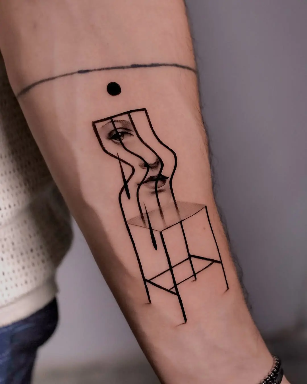 Unique Chair Tattoo with Artistic Face Design