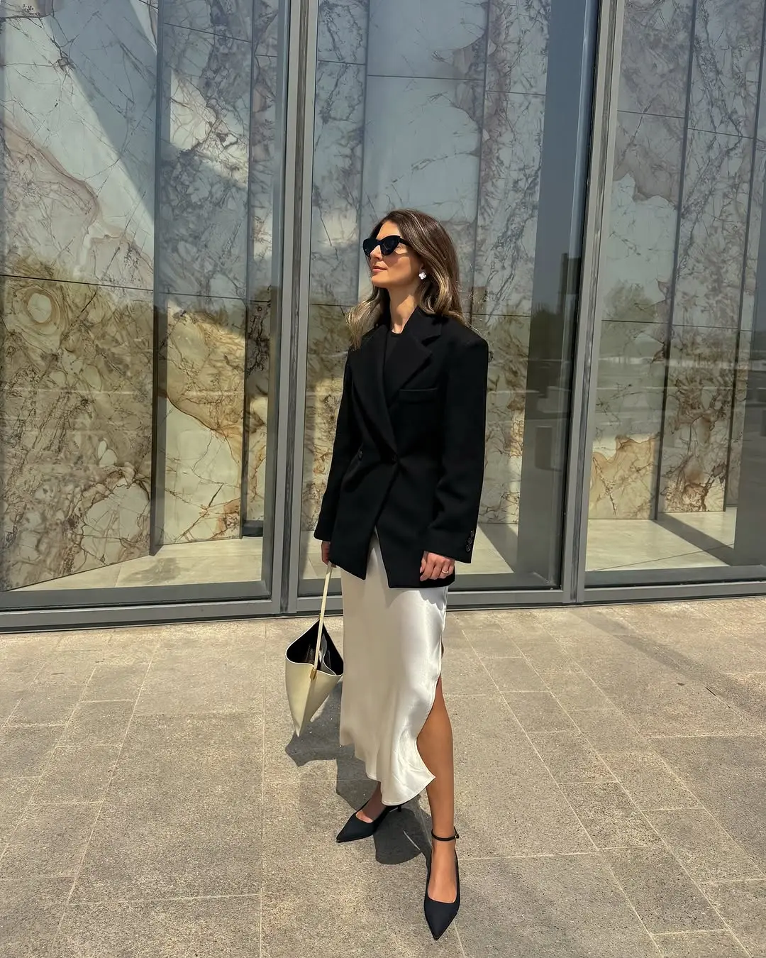 Stylish black blazer with elegant silk skirt