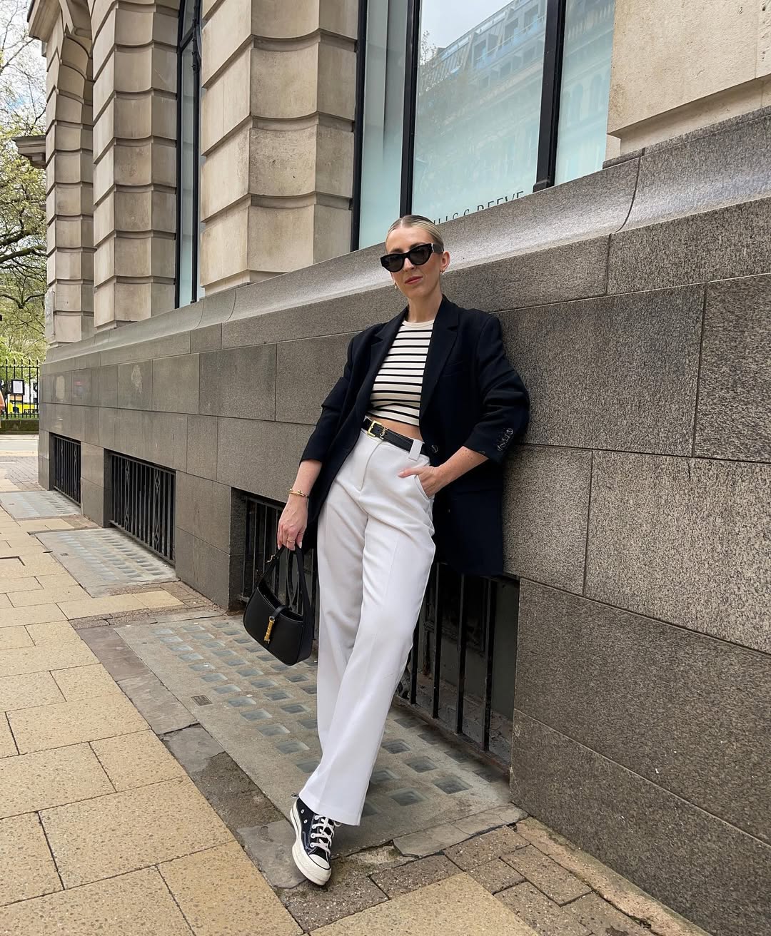 Chic black blazer with relaxed white trousers