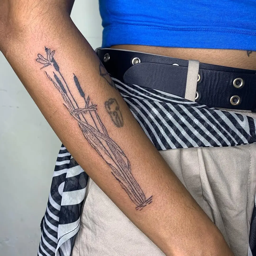 Stylish cattail tattoo design on the forearm