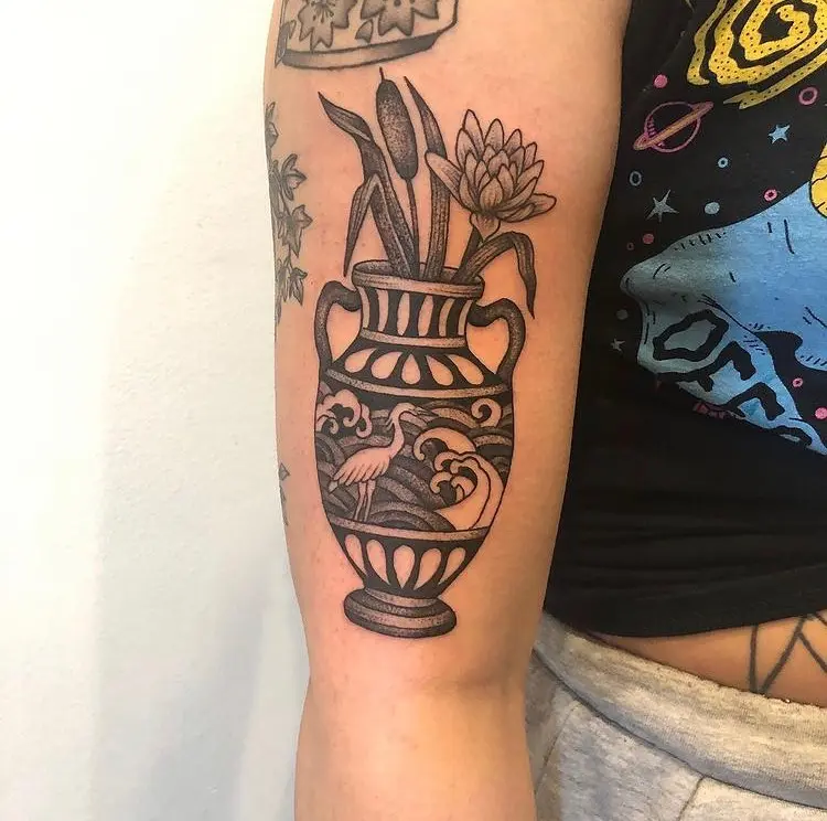 Stunning cattail tattoo in a vintage vase