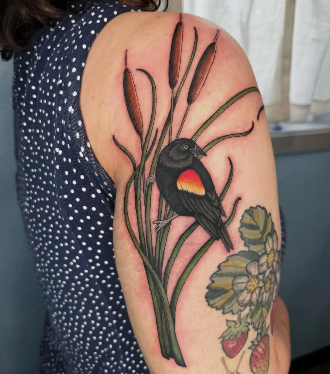 Vibrant cattail tattoo with bird illustration
