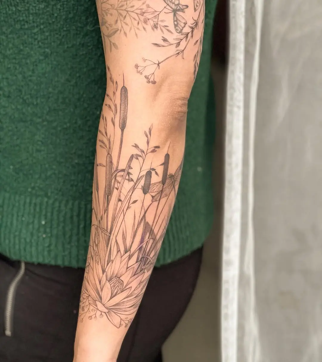 Elegant cattail tattoo showcasing nature's beauty