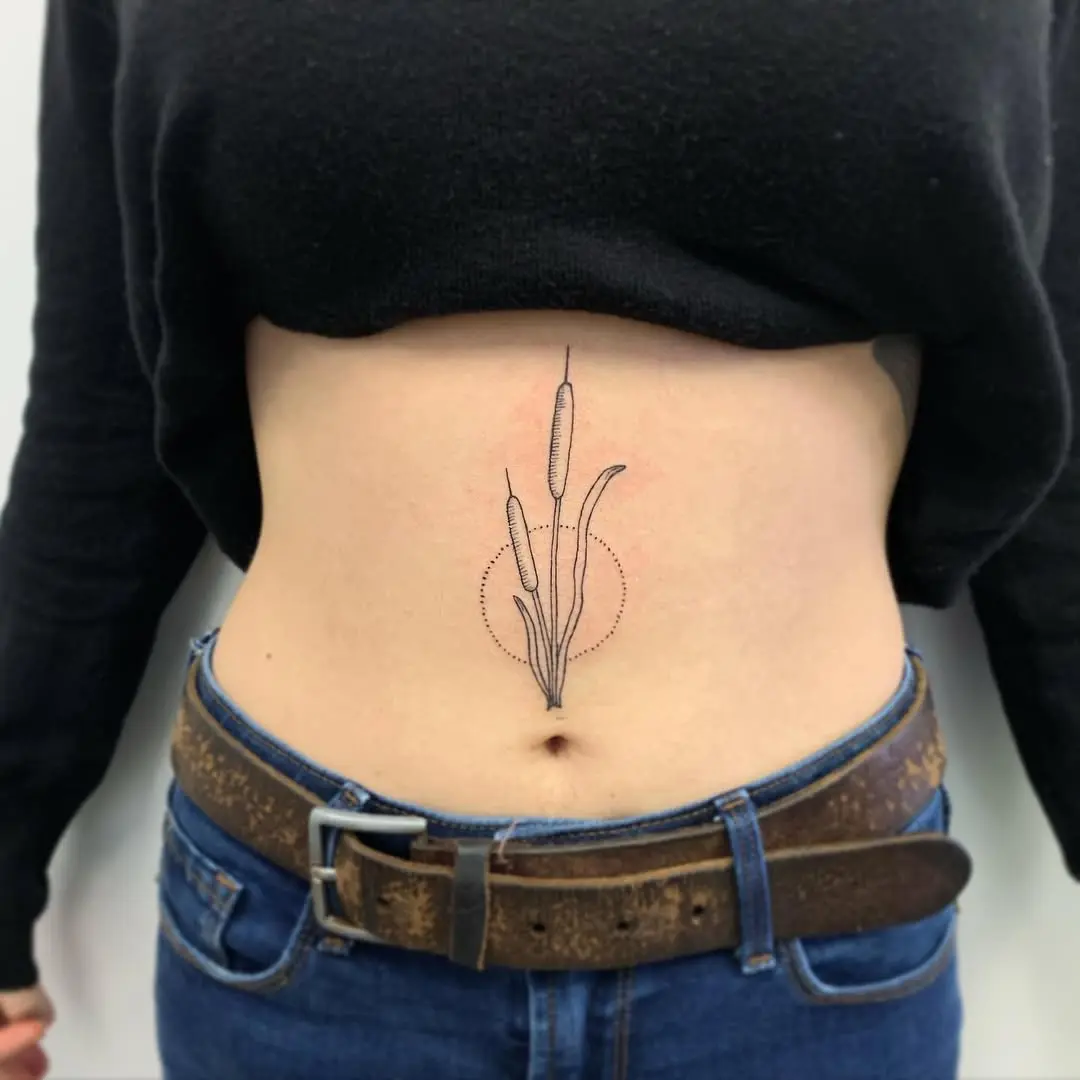 Elegant cattail tattoo on the belly