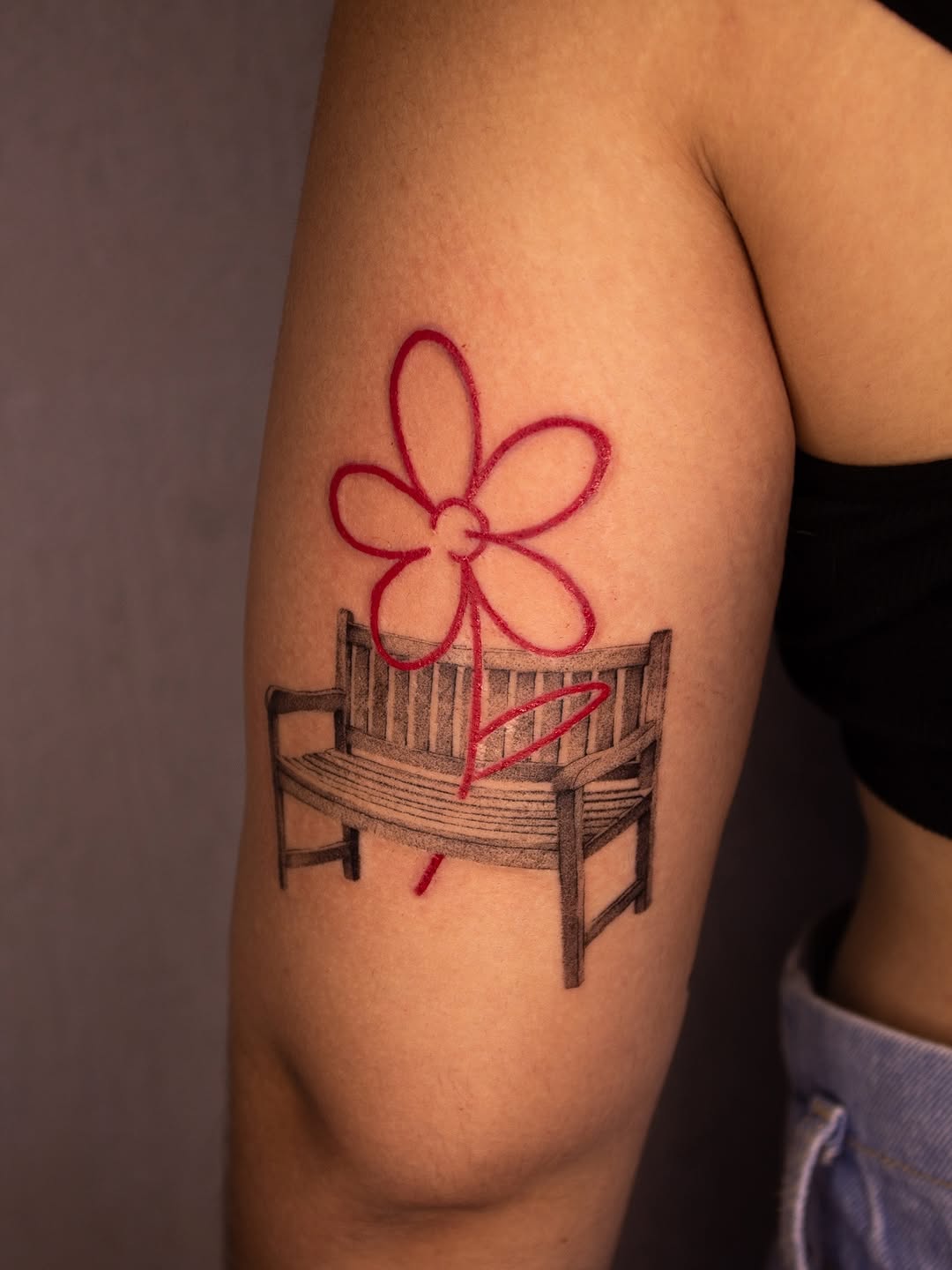 Charming chair tattoo with floral touch