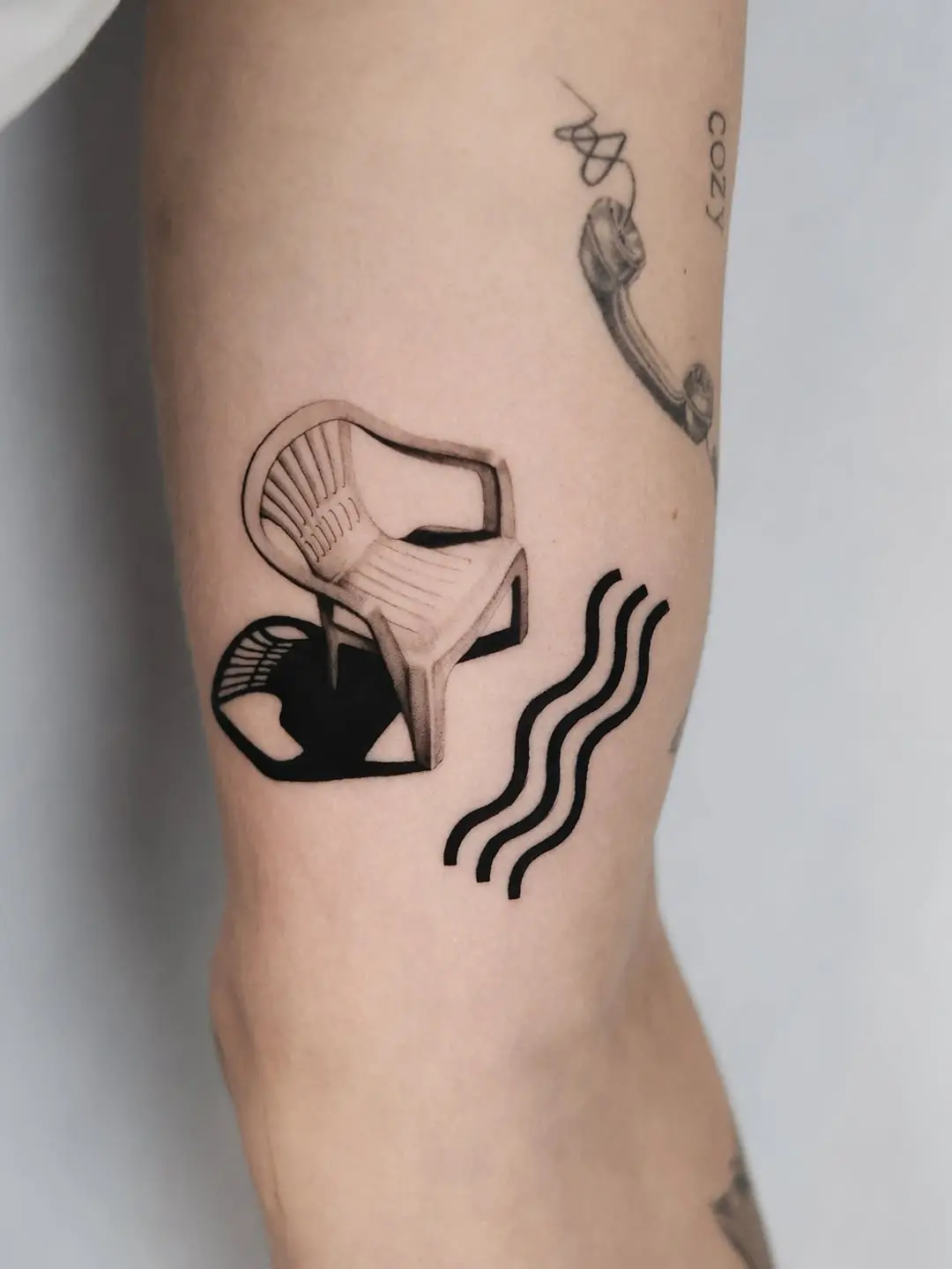 Unique chair tattoo with artistic flair