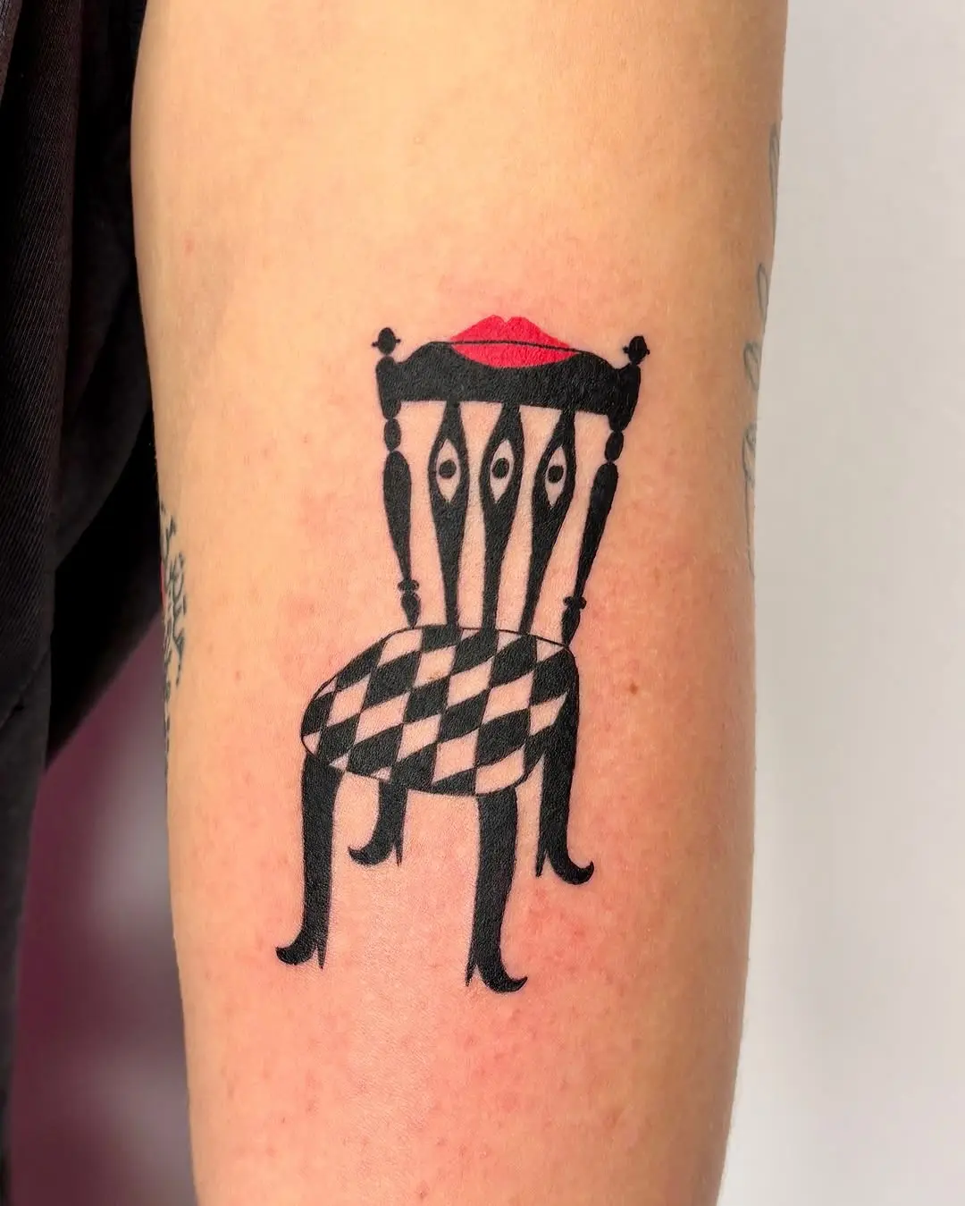 Unique chair tattoo with playful design elements