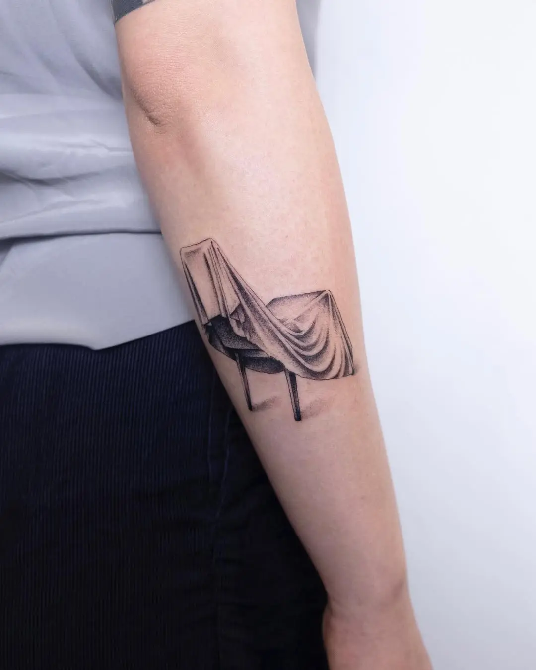 Realistic chair tattoo with draped fabric