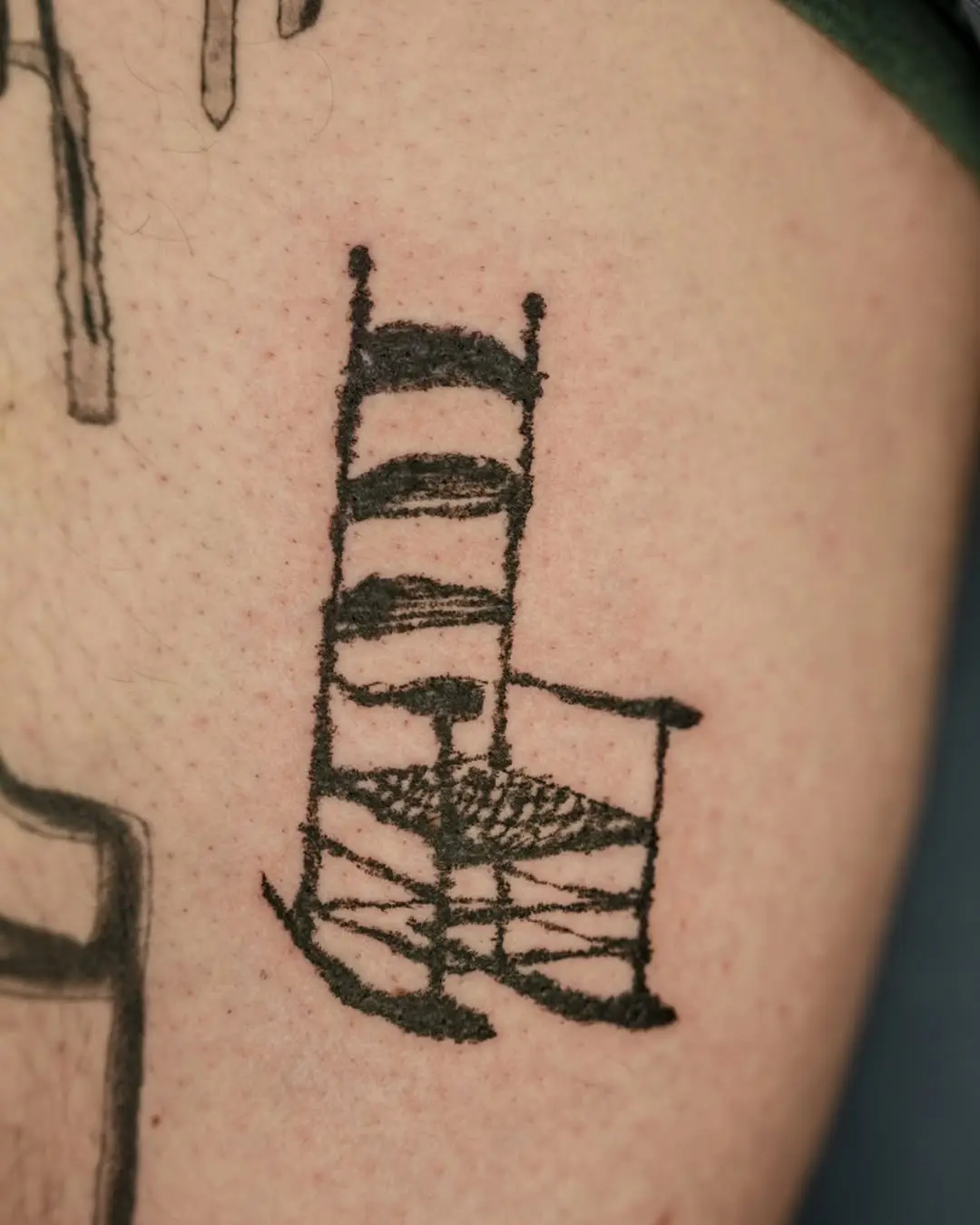 Unique rocking chair tattoo showcasing comfort and nostalgia