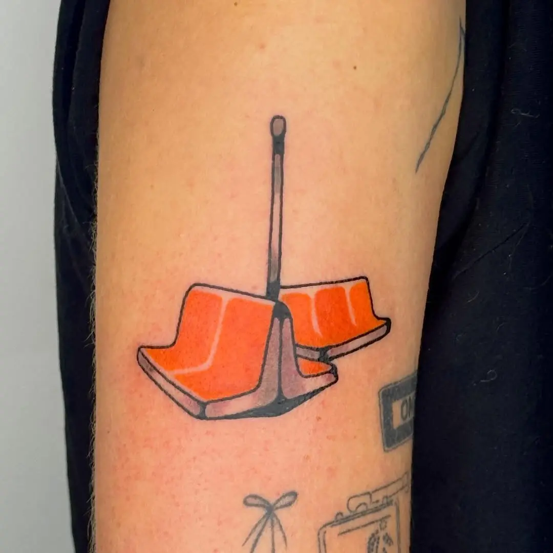 Vibrant chair tattoo showcasing playful design.