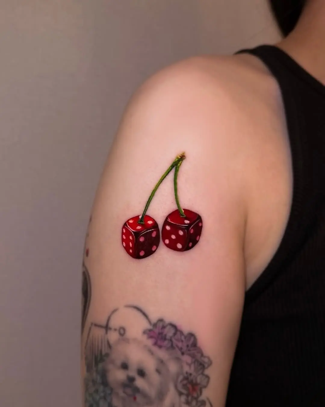 Playful cherry and dice tattoo design