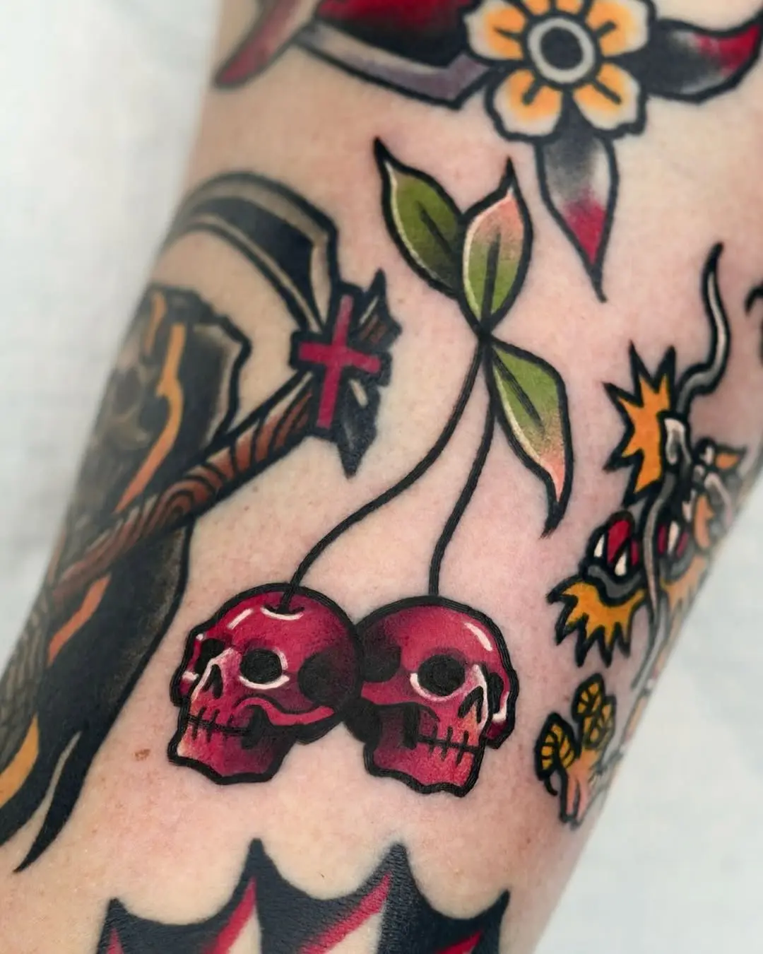 Bold skull and cherry tattoo design for rebels
