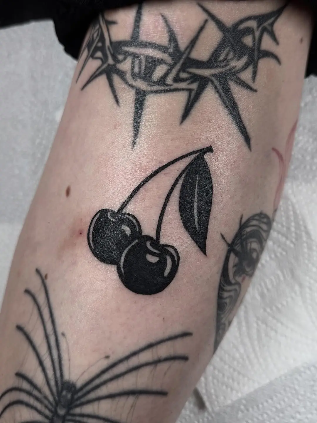 Minimalist Cherry Tattoo with Bold Lines