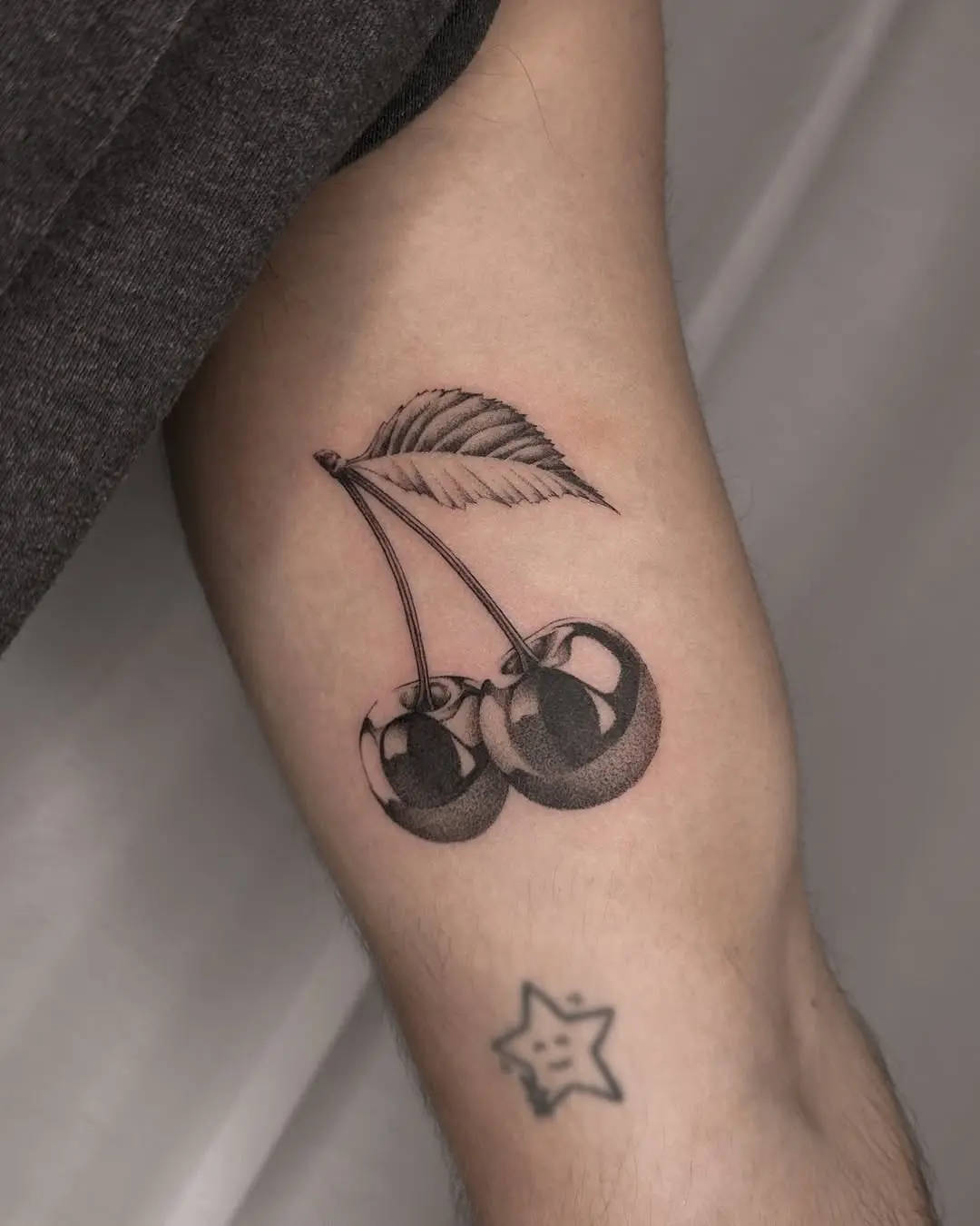 Stylish black and white cherry tattoo design