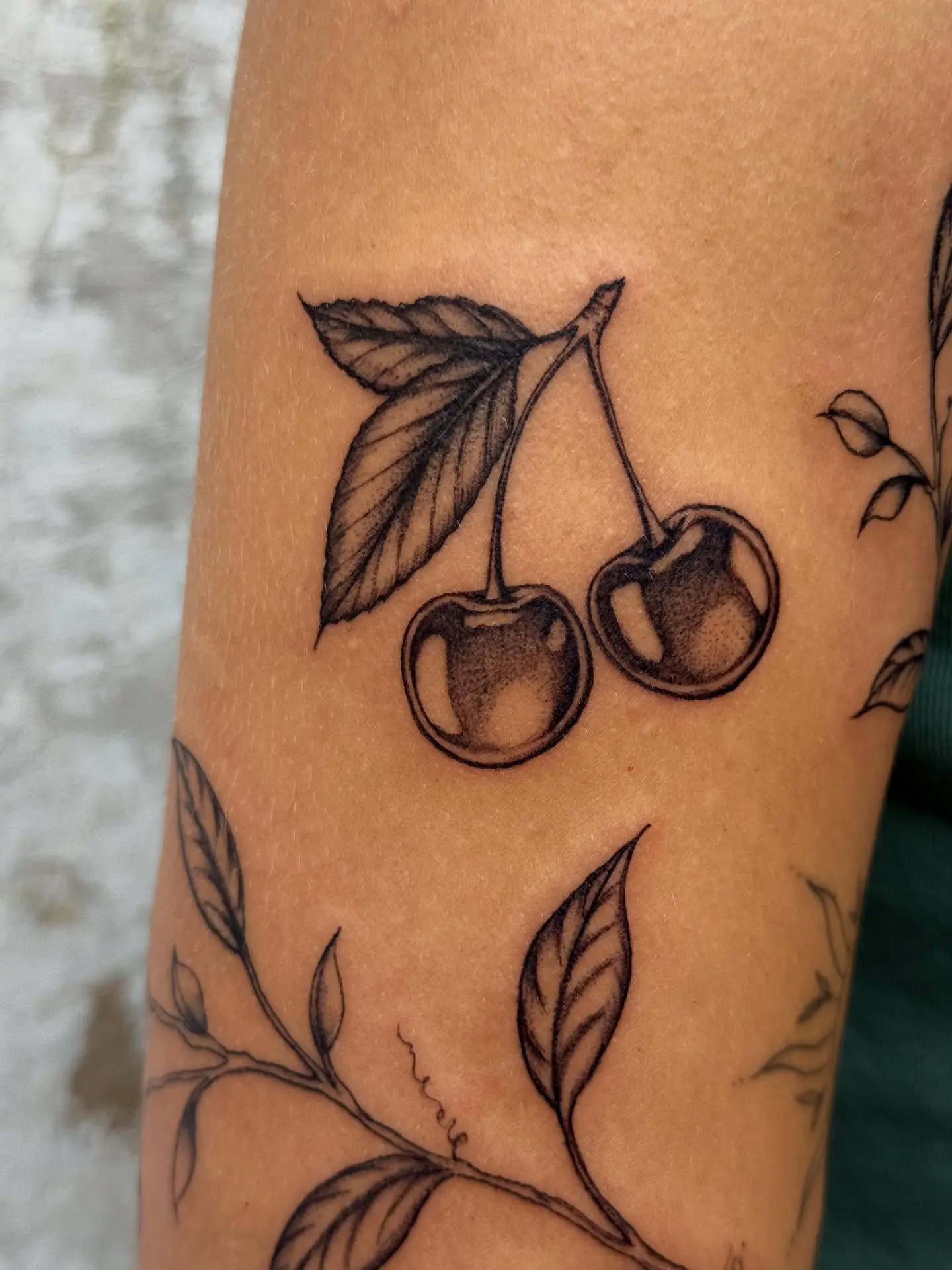 Elegant minimalist cherry tattoo design