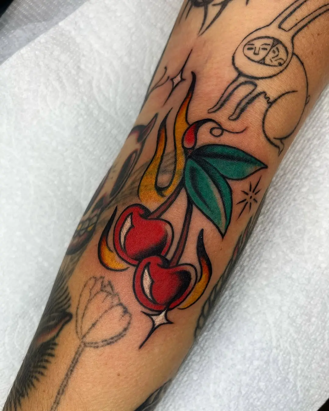Colorful Cherry Tattoo with Bold Design