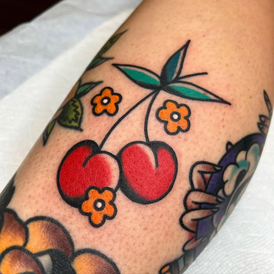 Charming cherry tattoo with vibrant colors