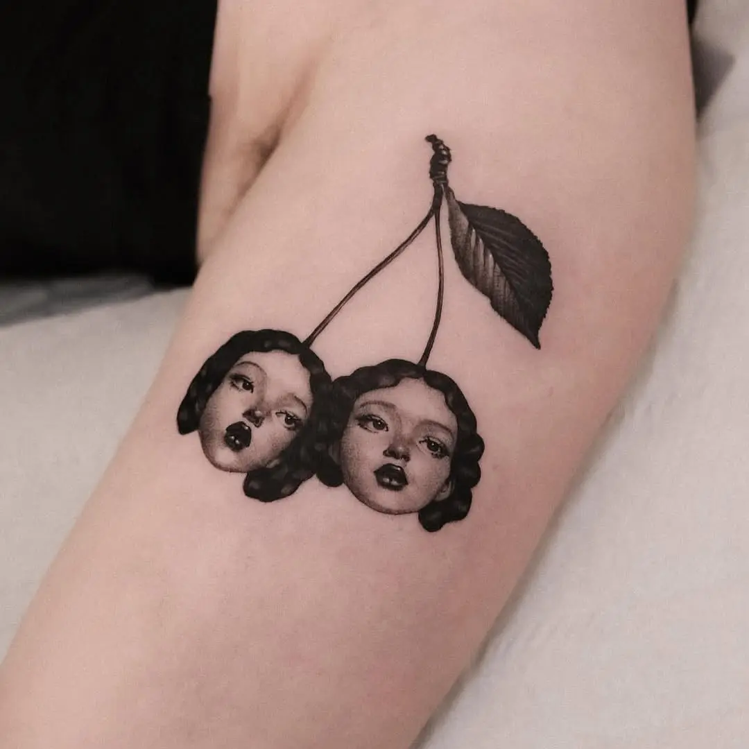 Unique cherry tattoo with artistic flair