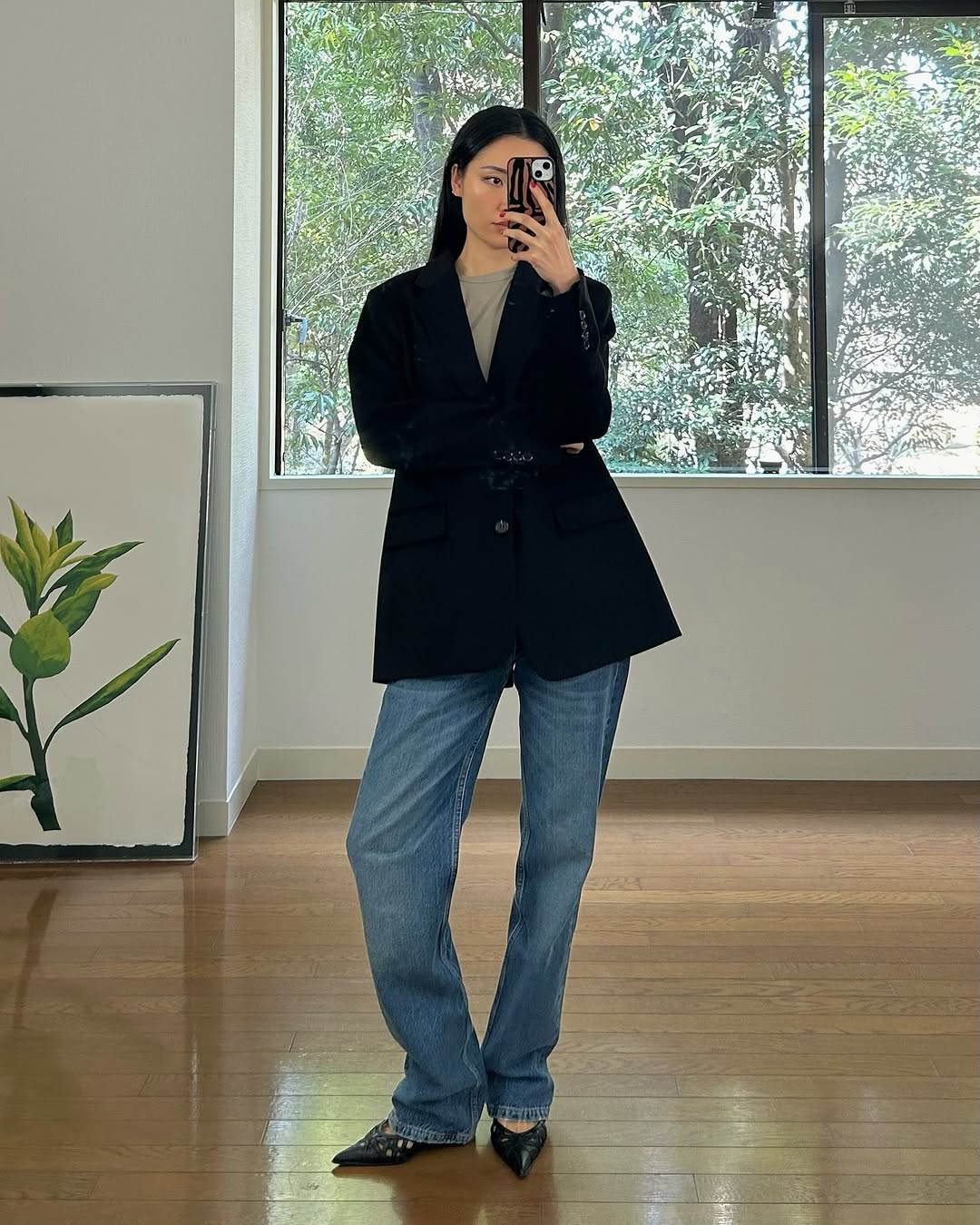 Stylish Black Blazer with Flared Jeans Ensemble