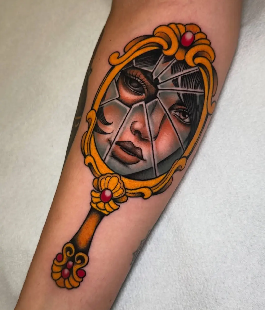 Artistic cracked mirror design with face reflection