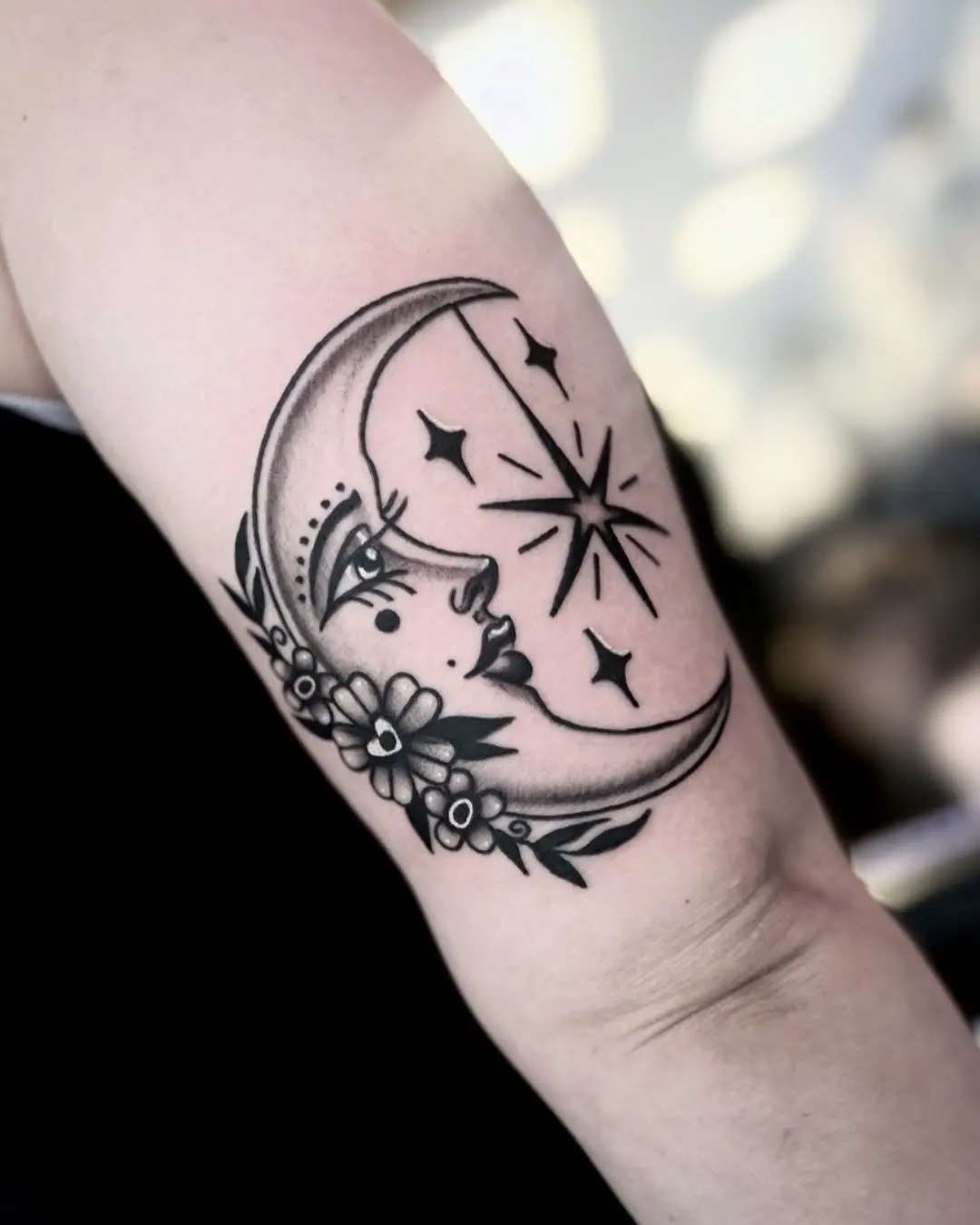 Elegant crescent moon face with floral accents