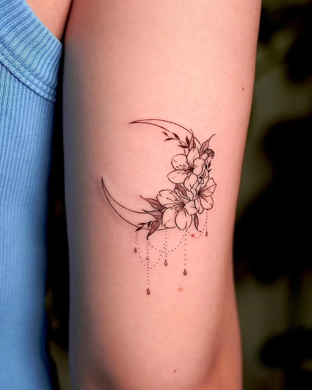 Elegant floral crescent moon tattoo design