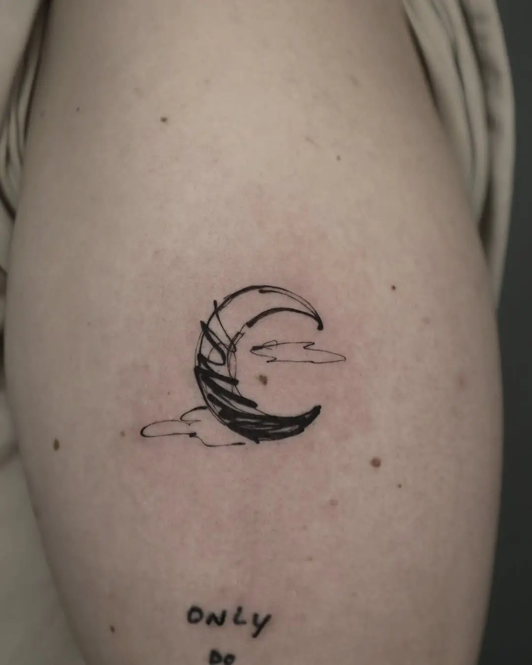 Stunning minimalist crescent moon tattoo design