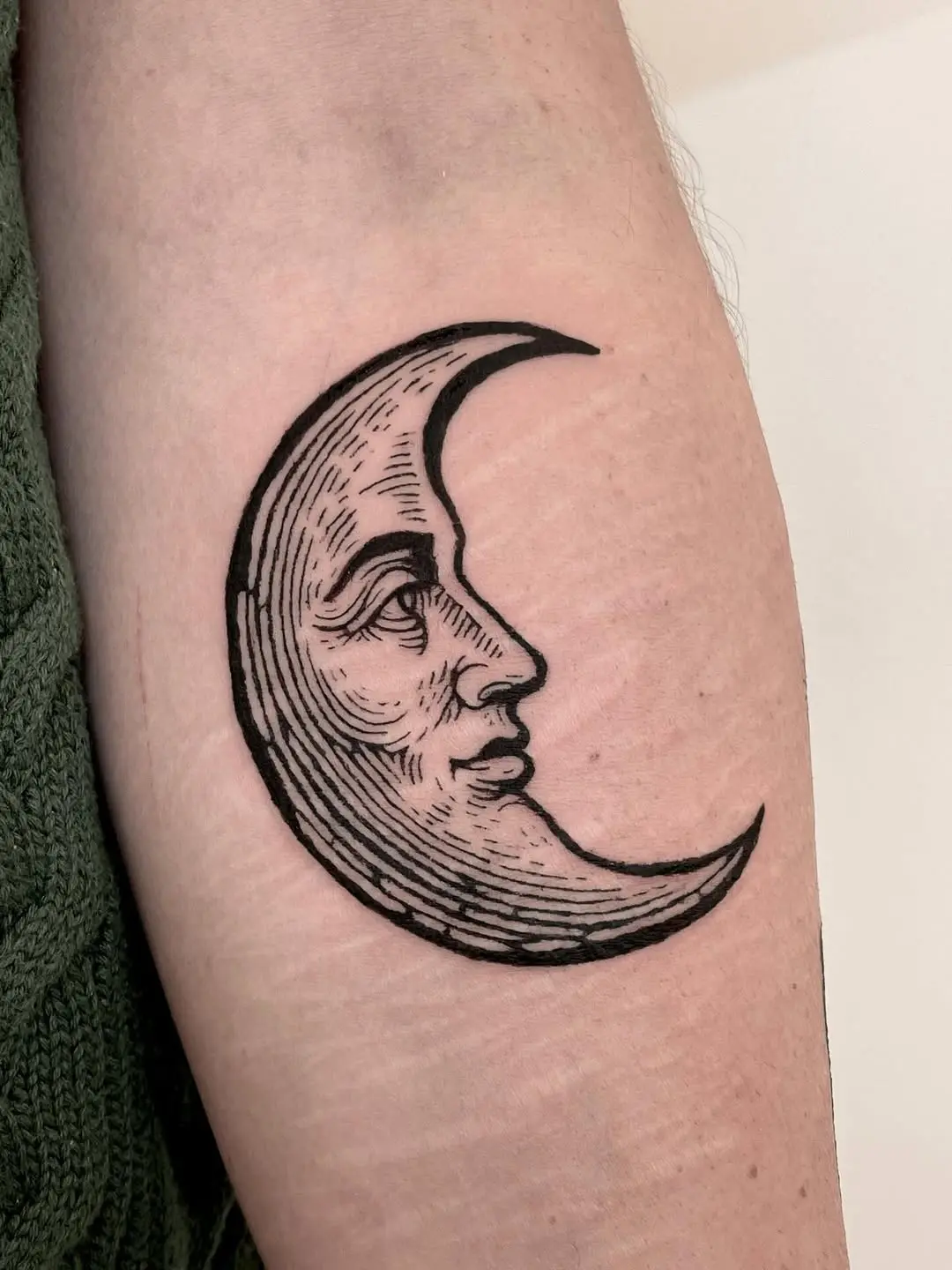 Intricate Crescent Moon Tattoo with Hybrid Face