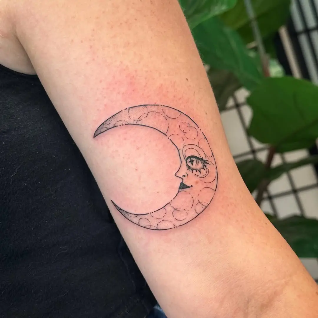 Elegant crescent moon with a mystical face