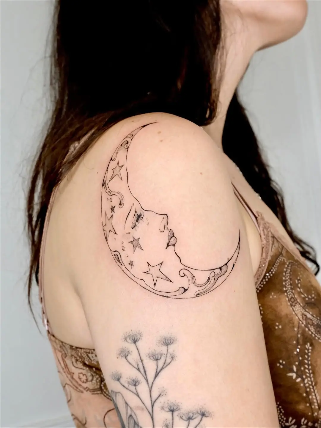 Elegant crescent moon ink with celestial details