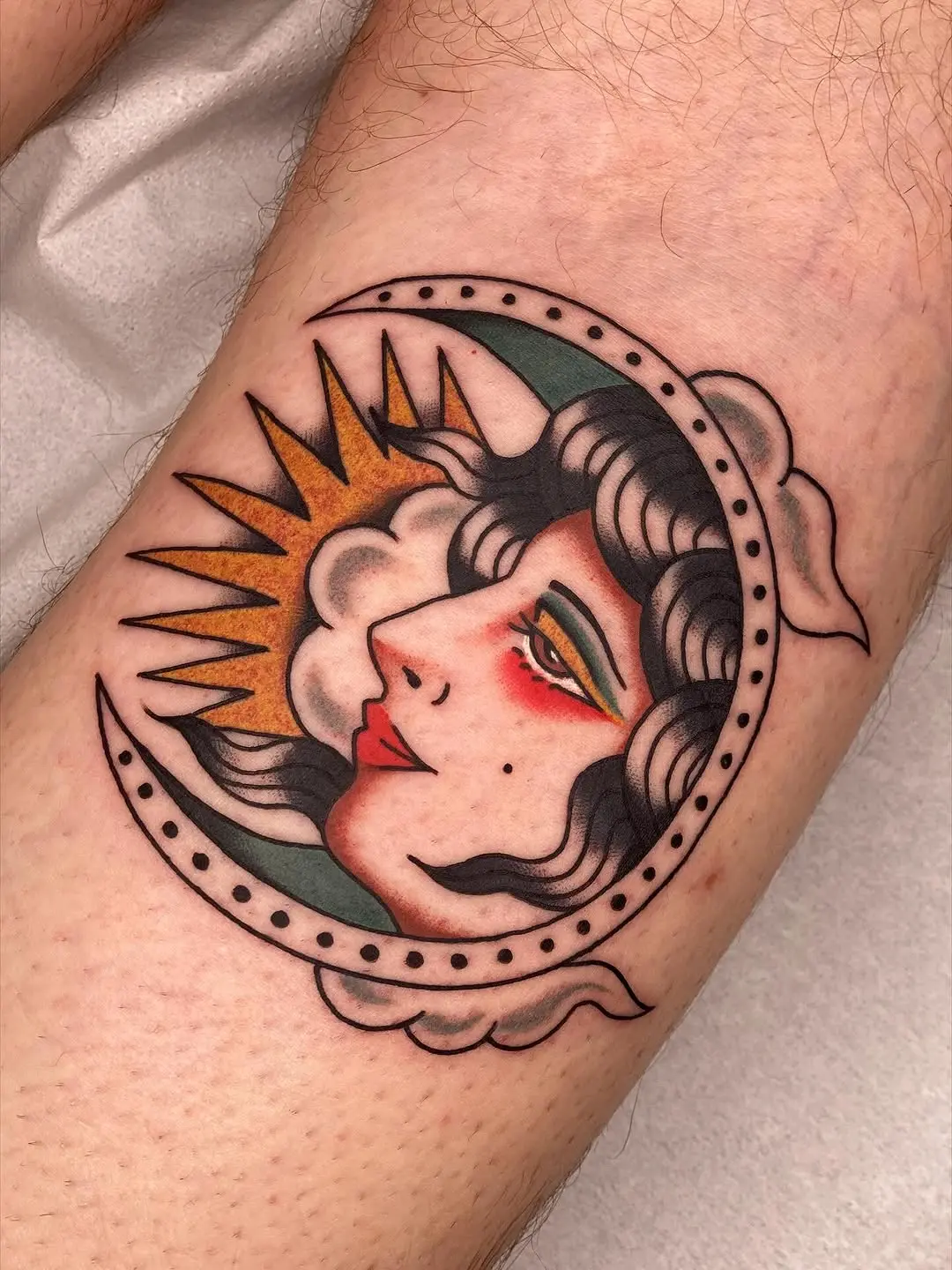 Stylish crescent moon with sun emblem tattoo