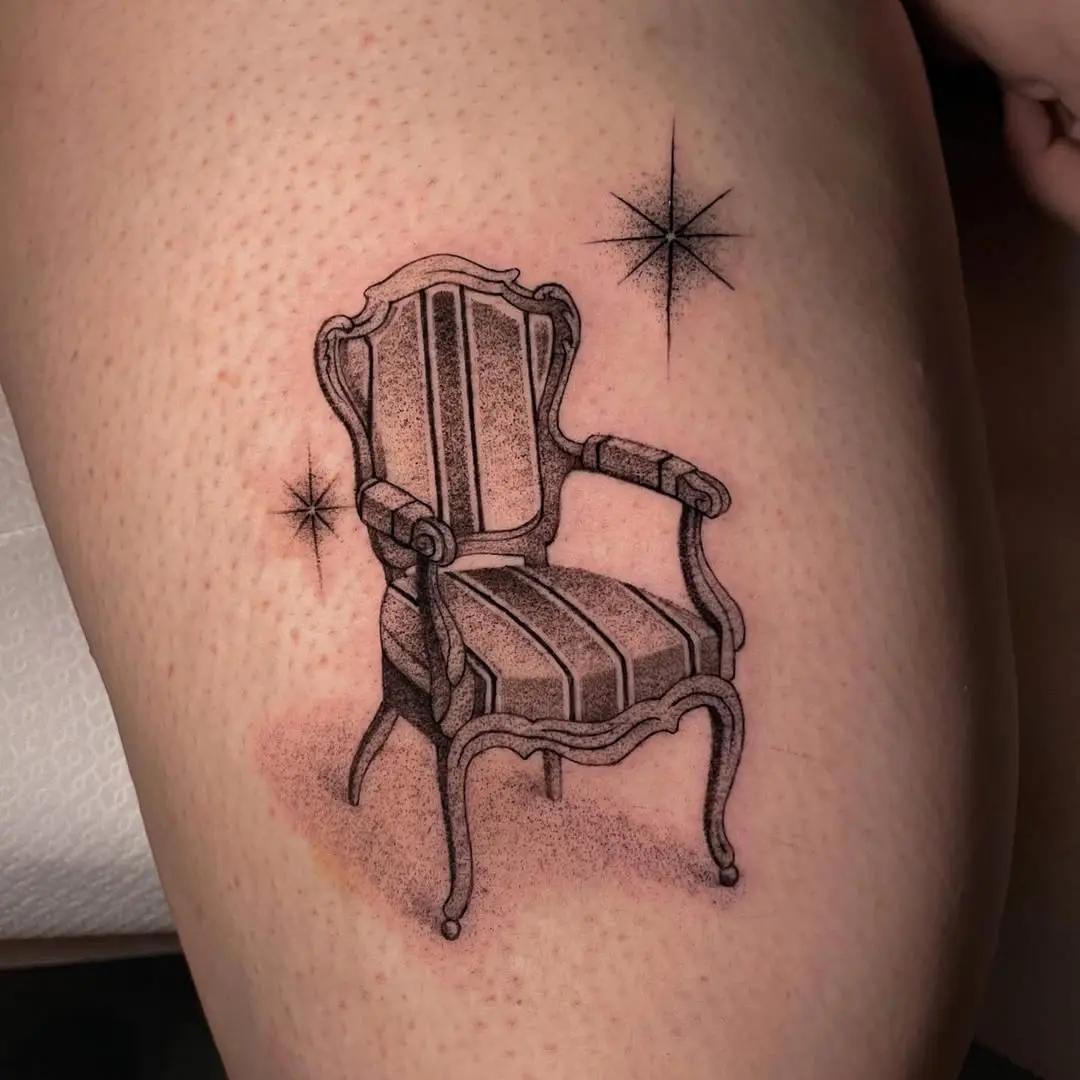 Artistic chair tattoo with star accents