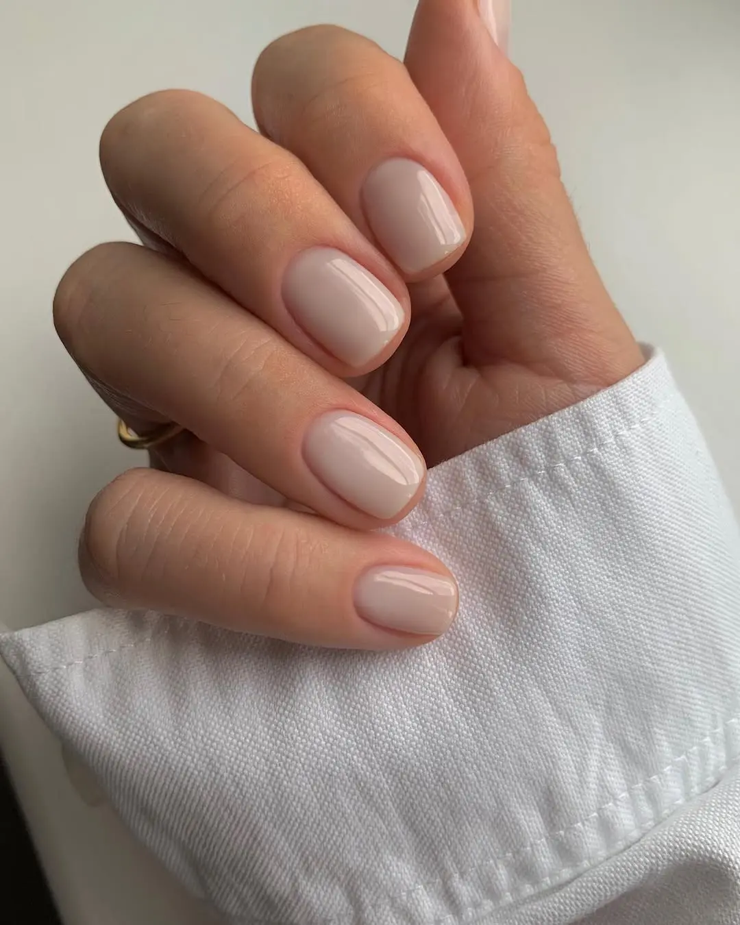 Chic nude graduation nails for a minimalist look