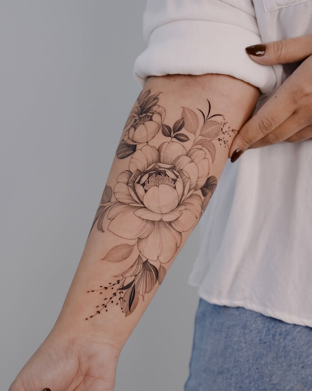 Stunning peony tattoo with intricate details
