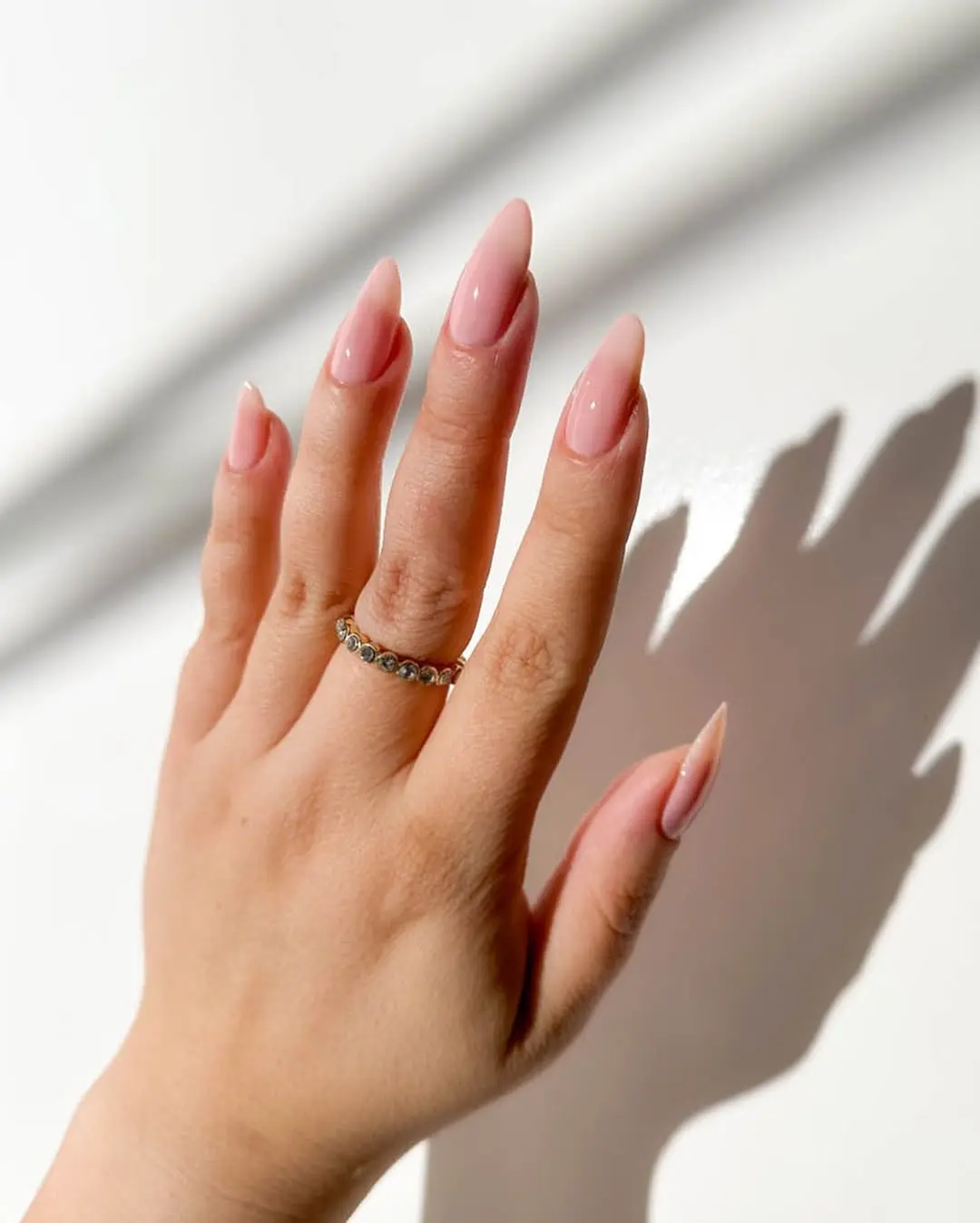 Elegant pink nails with a classic twist