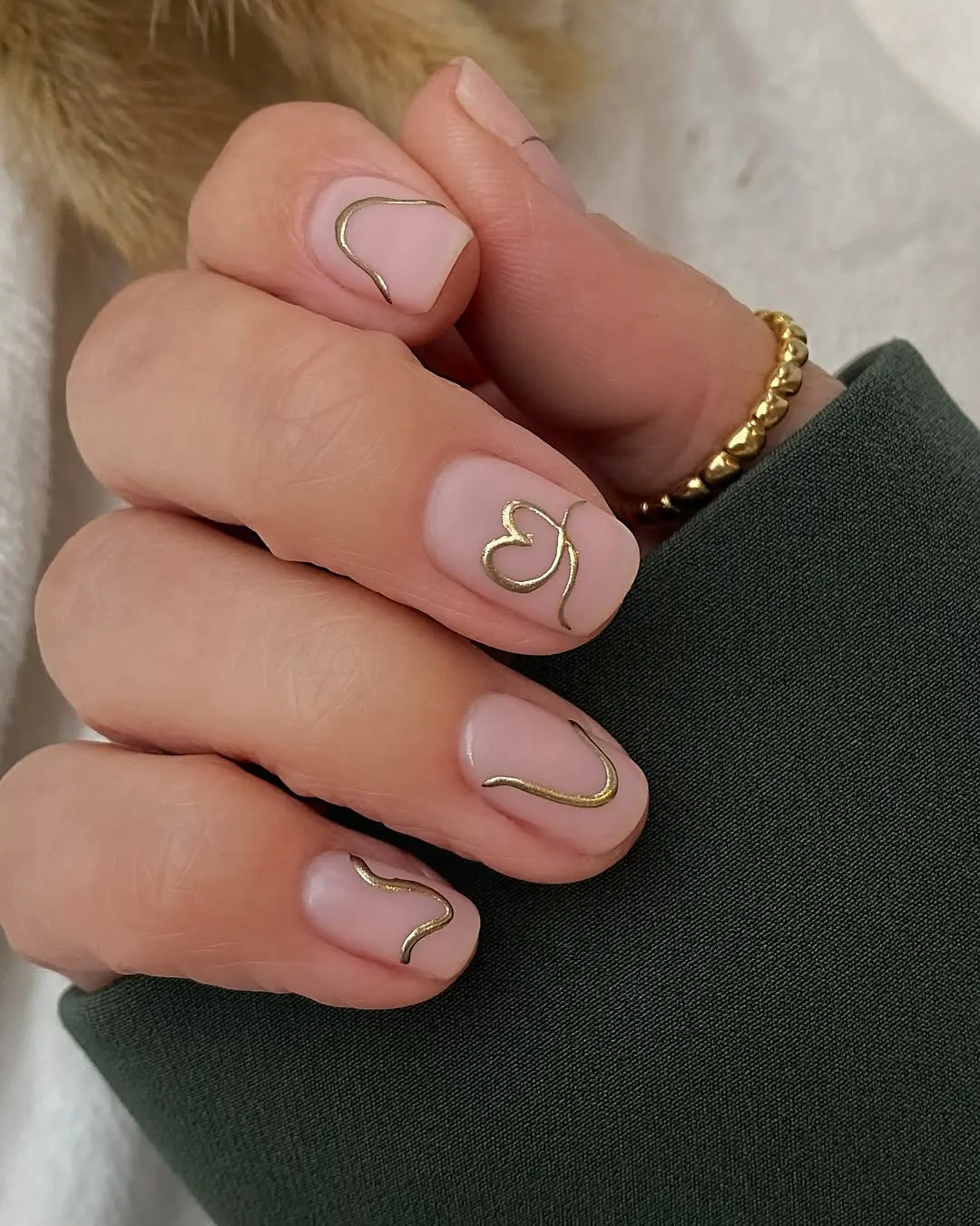 Chic February Nails with Gold Accents