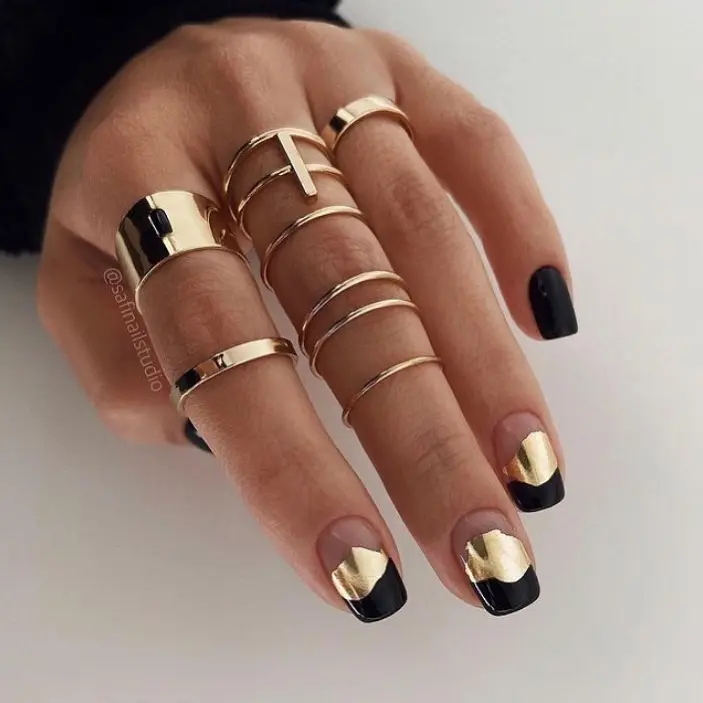 Chic black and gold graduation nail design