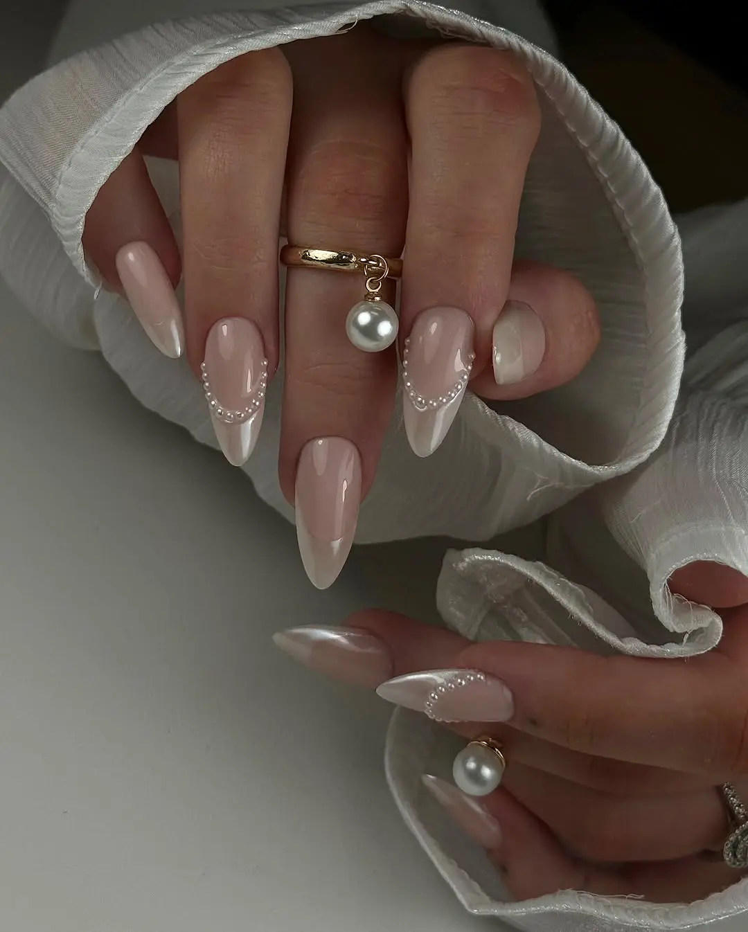 Elegant graduation nails with pearl accents