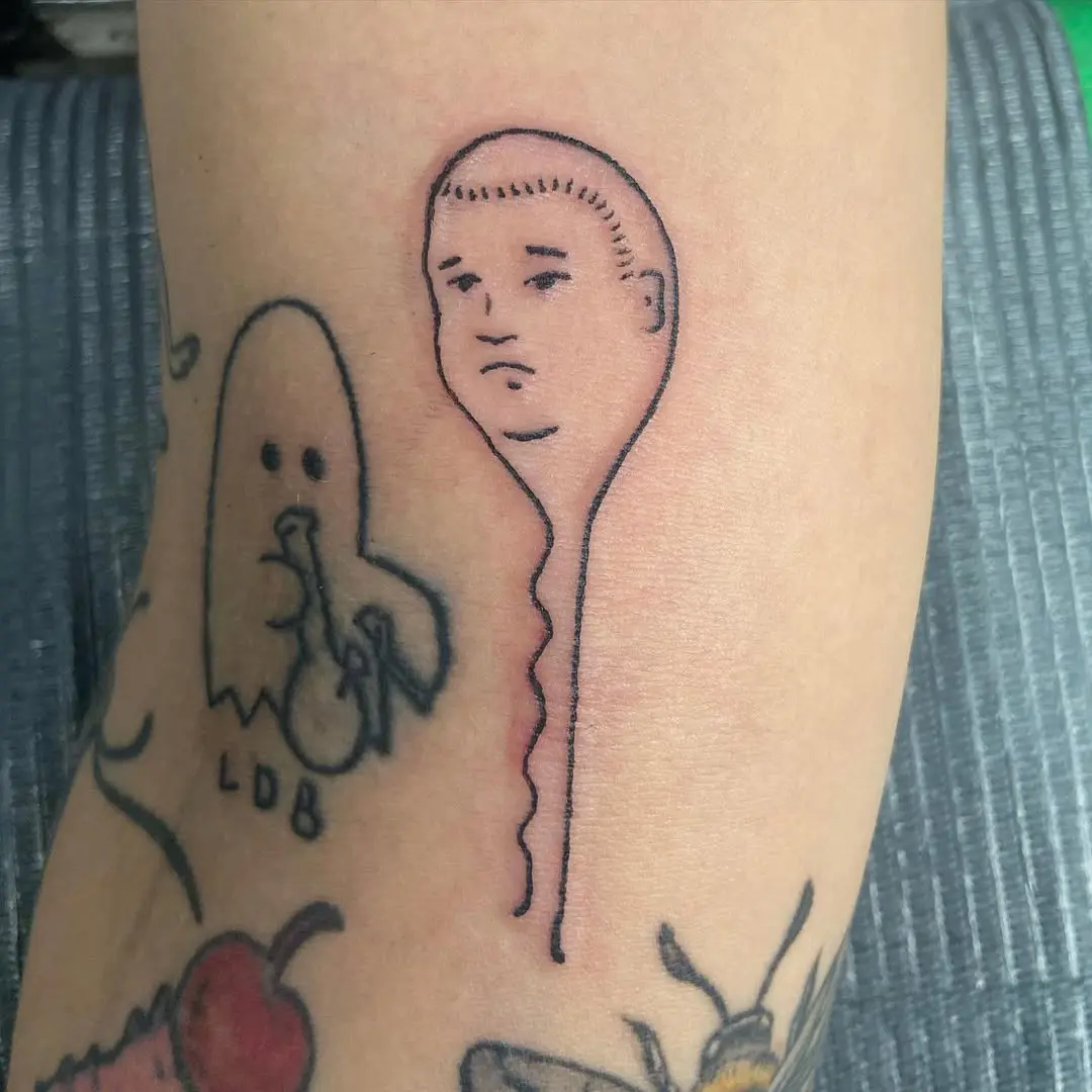 Quirky sperm tattoo with a unique expression