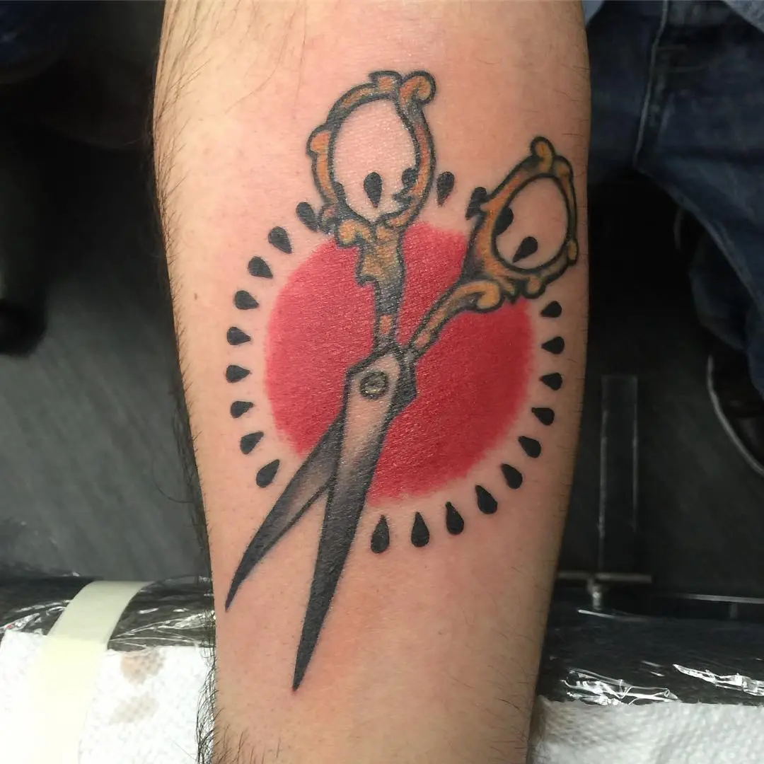 Bold scissors tattoo for hair styling vibes