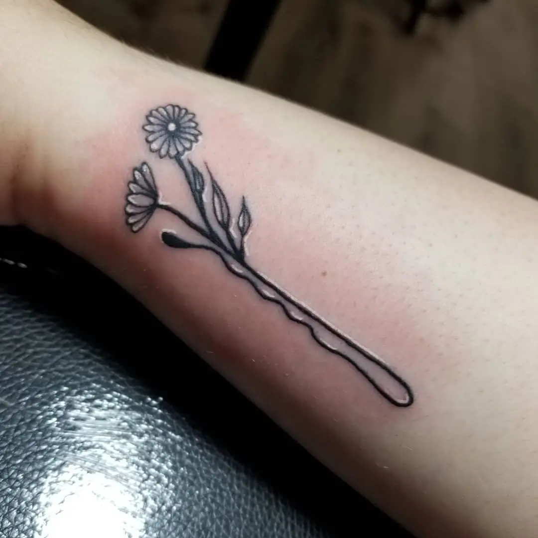 Stylish floral bobby pin tattoo design