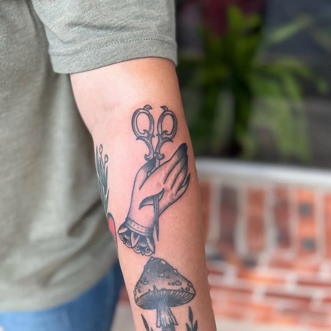 Unique Hand and Scissors Tattoo Design