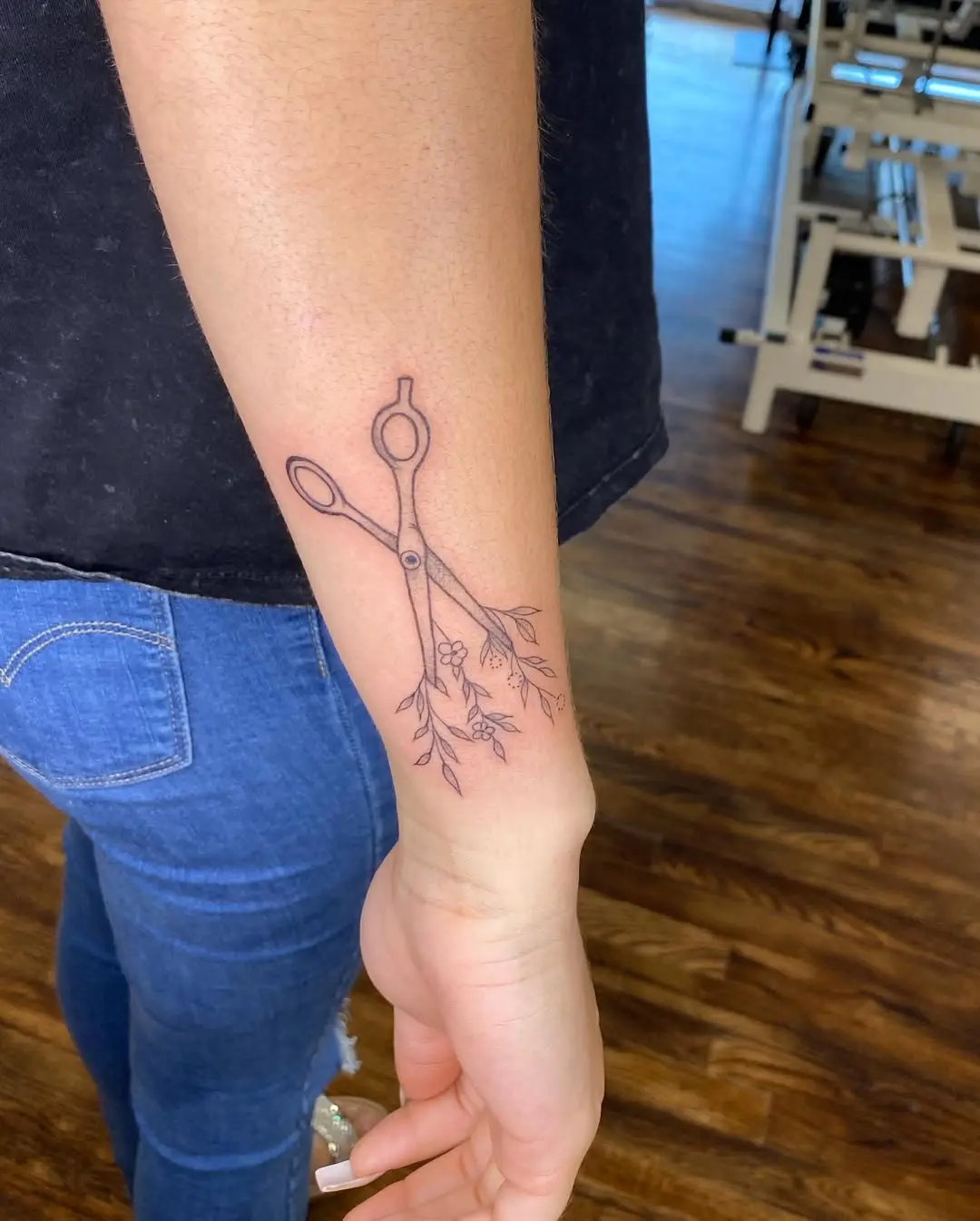Chic scissors tattoo with floral embellishments