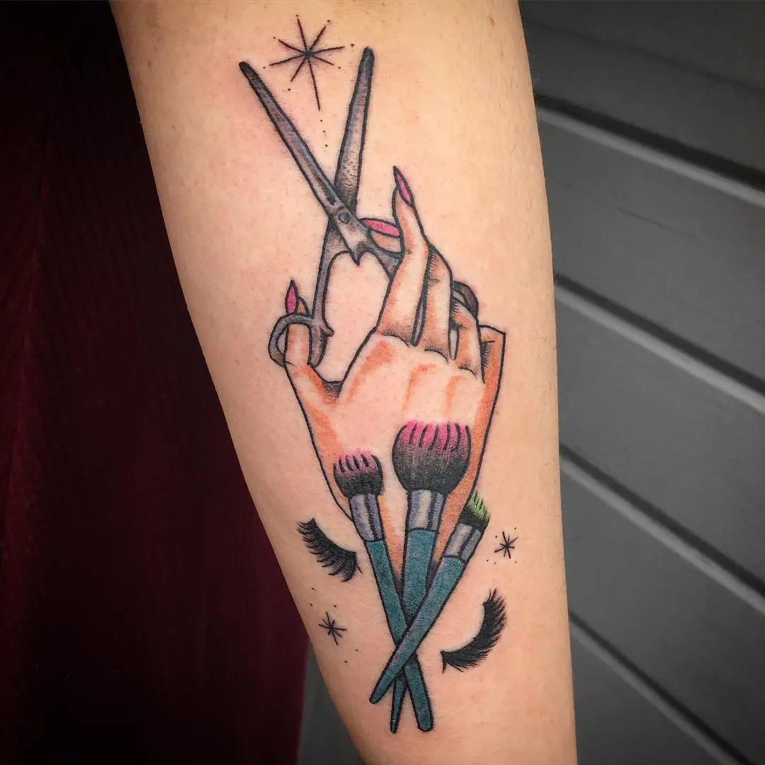 Bold Hand Tattoo with Scissors and Brushes