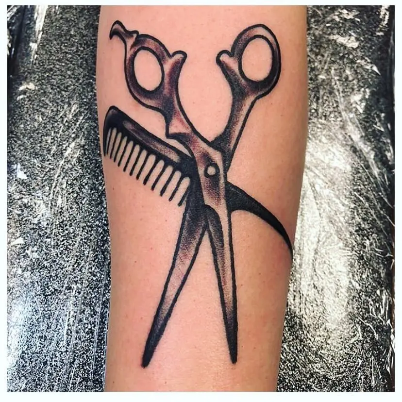 Unique tattoo showcasing stylist tools elegantly
