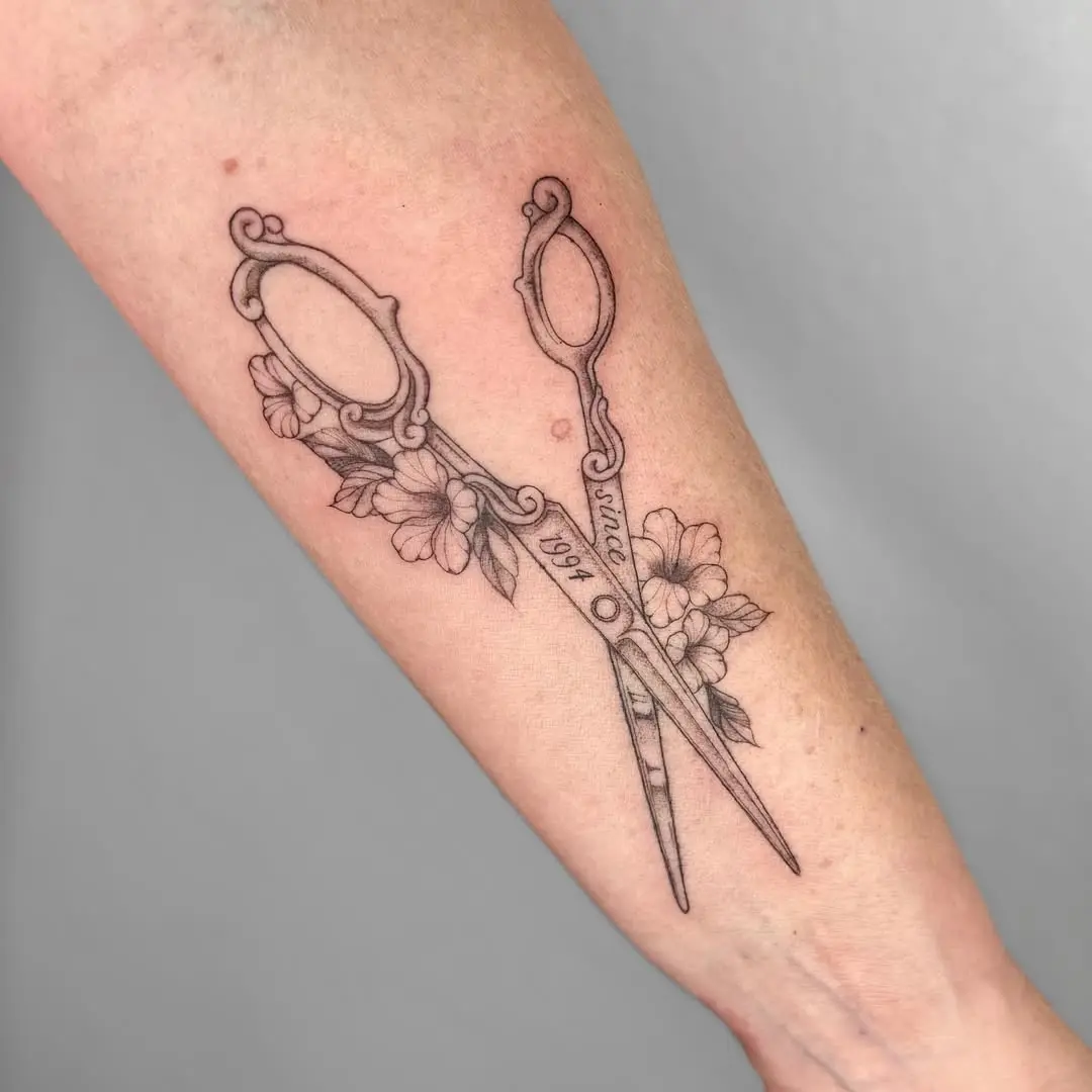 Intricate Scissors Tattoo with Floral Accents